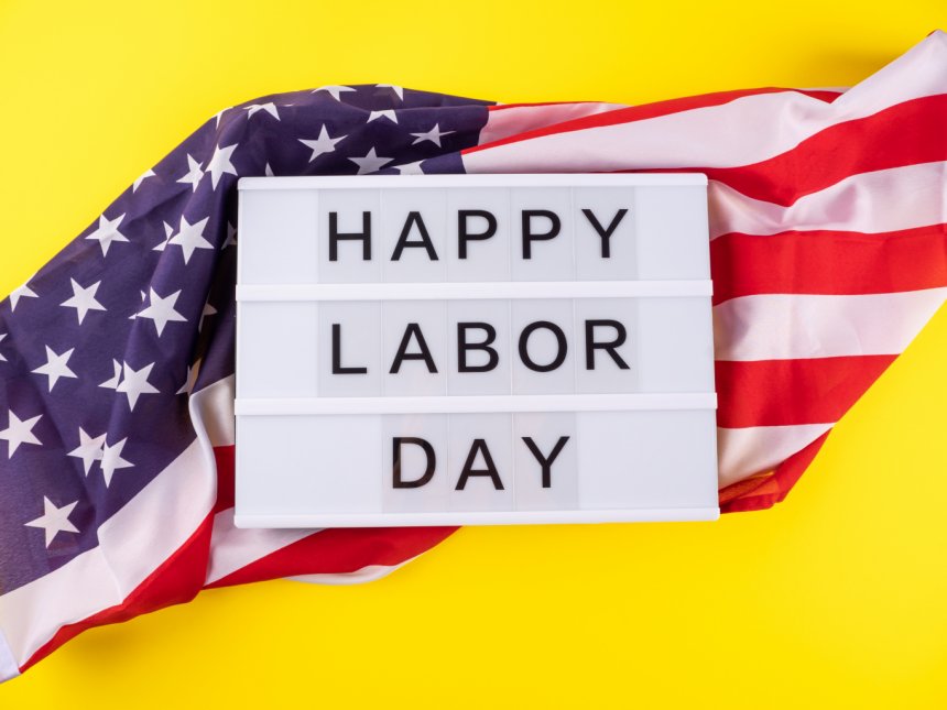 Labor Day Poster on top of the U.S. flag