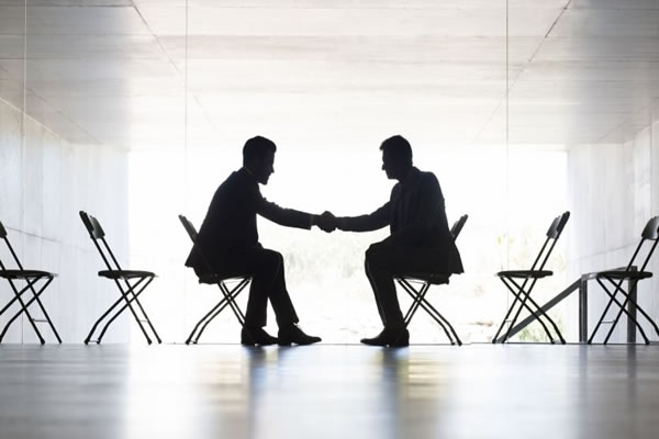Two people shaking hands about The Benefits of White Label Marketing